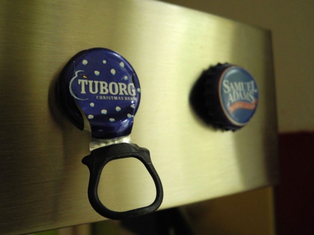 A Tubor Christmas pull–off cap. By the way, starting November we should have this again in shops. Hardly can wait. I like this beer. Anyway, I managed to create some magnets out of this snap–offs too. They look great on our kitchen hood.